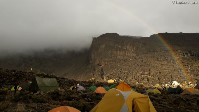  Barranco camp, tents pitched (near) with Barranco wall in the distance on a rainy day [1]