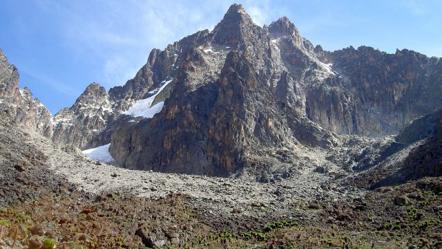 Batian peak of mount Kenya, (centre) with Nelion on its right and point Slade in front of it. A view from the south west [1]